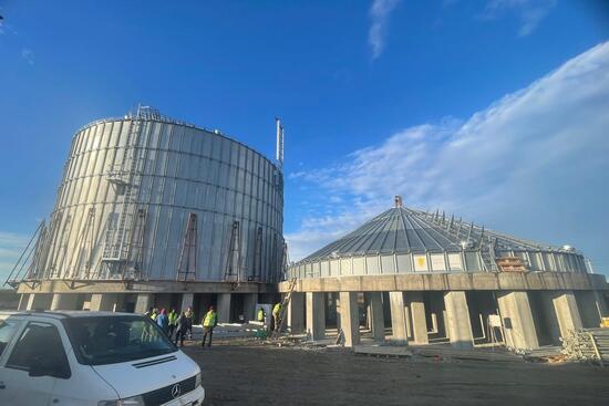 Different stages of Grain Capital silo installation, grain elevator construction site.